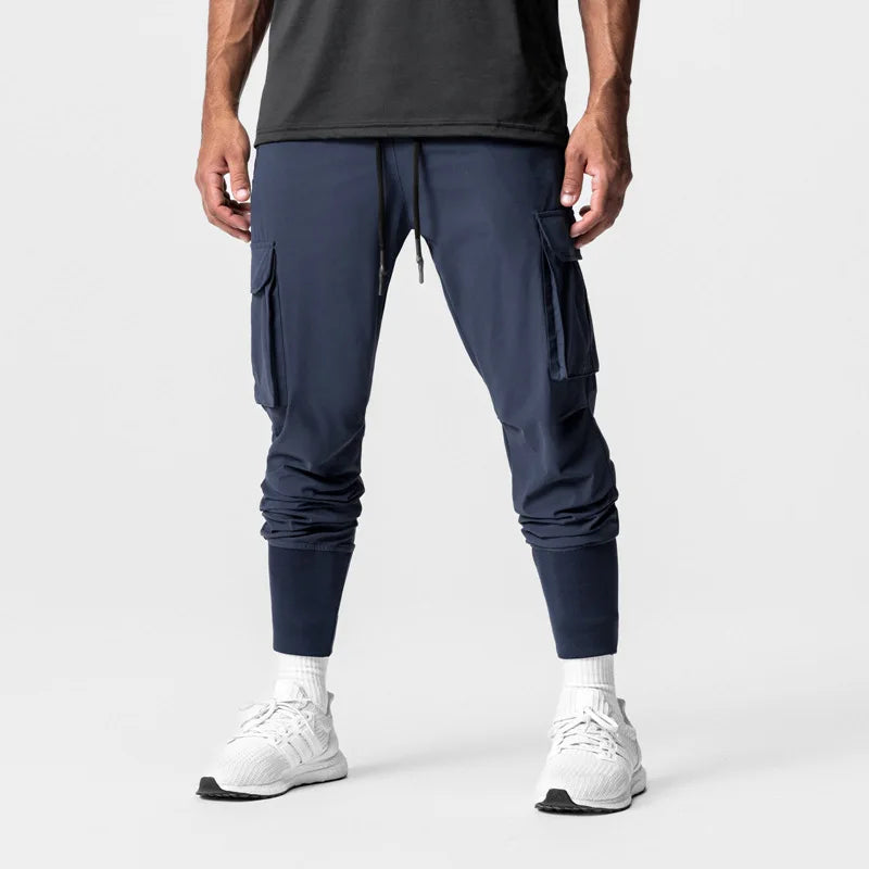 Nuevos pantalones deportivos de camuflaje para hombre, pantalones de fitness, pantalones de verano delgados, sueltos, de secado rápido, elásticos, pantalones de chándal para correr y entrenar.
