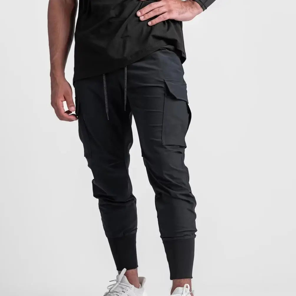 Nuevos pantalones deportivos de camuflaje para hombre, pantalones de fitness, pantalones de verano delgados, sueltos, de secado rápido, elásticos, pantalones de chándal para correr y entrenar.